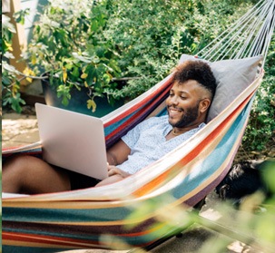 a man lounging in a hammock